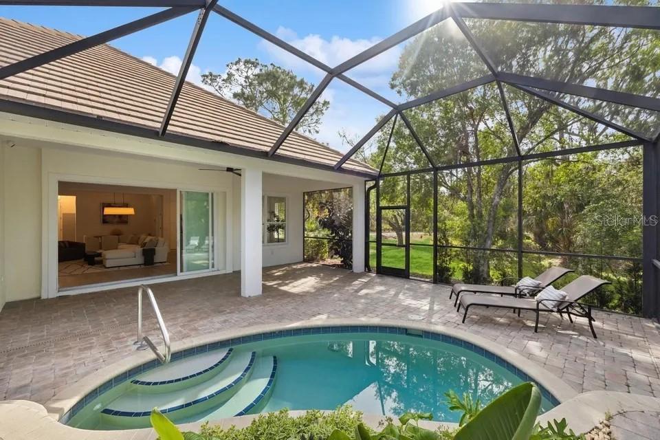 7346 Edenmore Street Lakewood Ranch, FL 34202 - Photo 5 of 70 a swimming pool with outdoor seating yard and livingroom