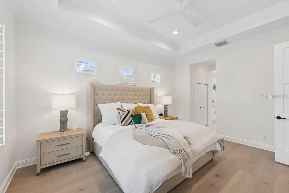 7346 Edenmore Street Lakewood Ranch, FL 34202 - Photo 7 of 70 a bed room with a bed and a night stand