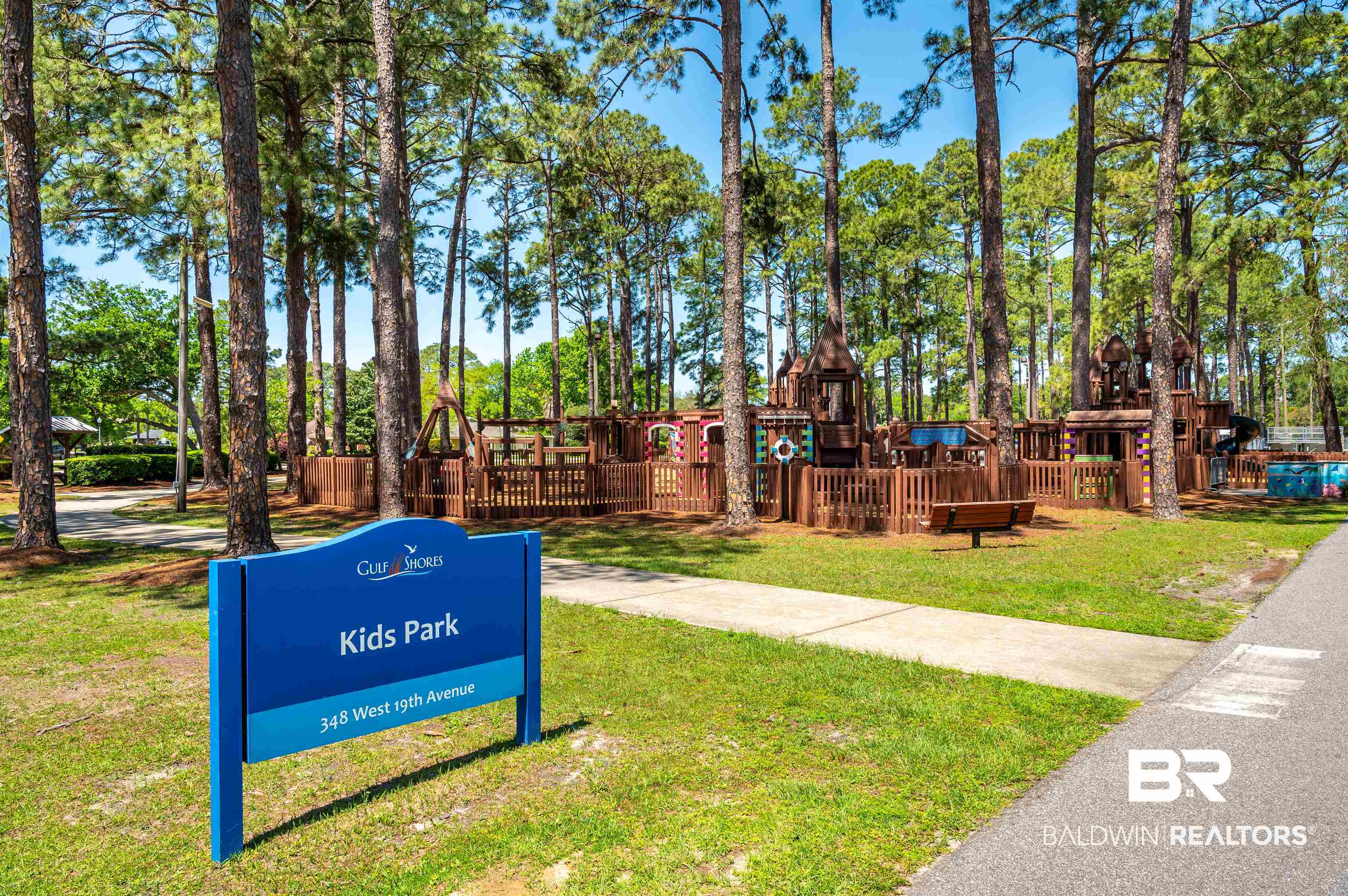 657 Island Way Gulf Shores, AL 36542 - Photo 48 of 59 View of property's community with playground community and a lawn