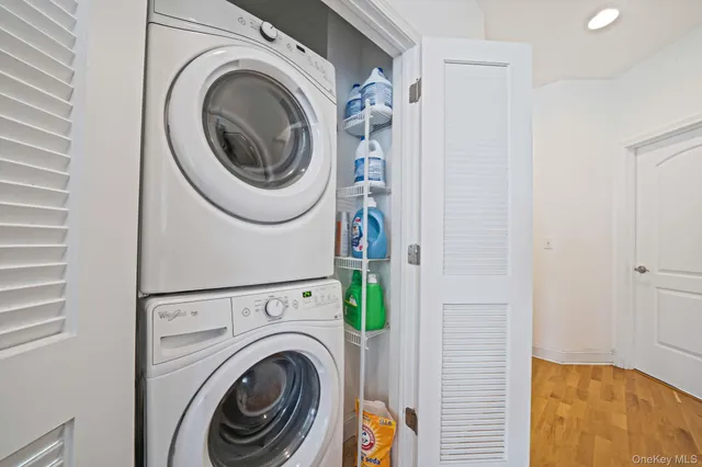 a view of a hallway with washer and dryer