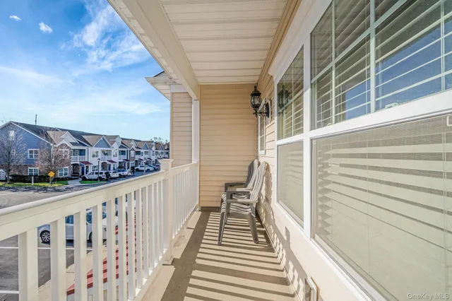 a view of balcony with wooden floor