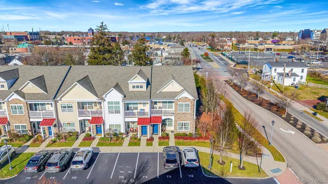 an outdoor space with seating area and trees in the background