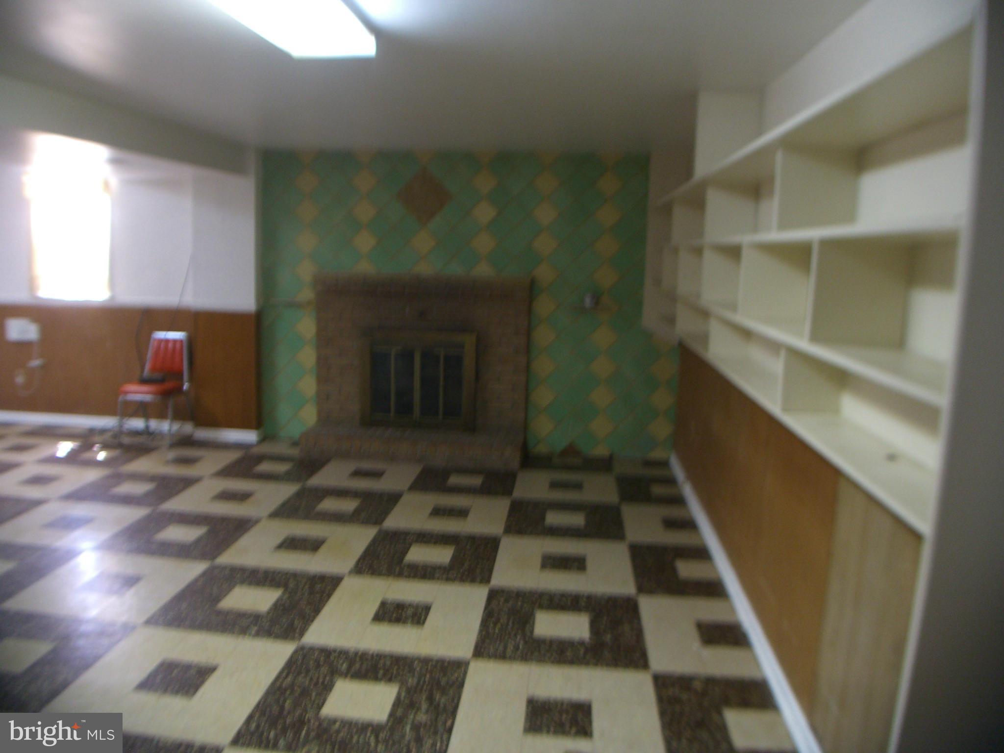 11304 Brandywine Road Clinton, MD 20735 - Photo 14 of 22 Basement Fireplace