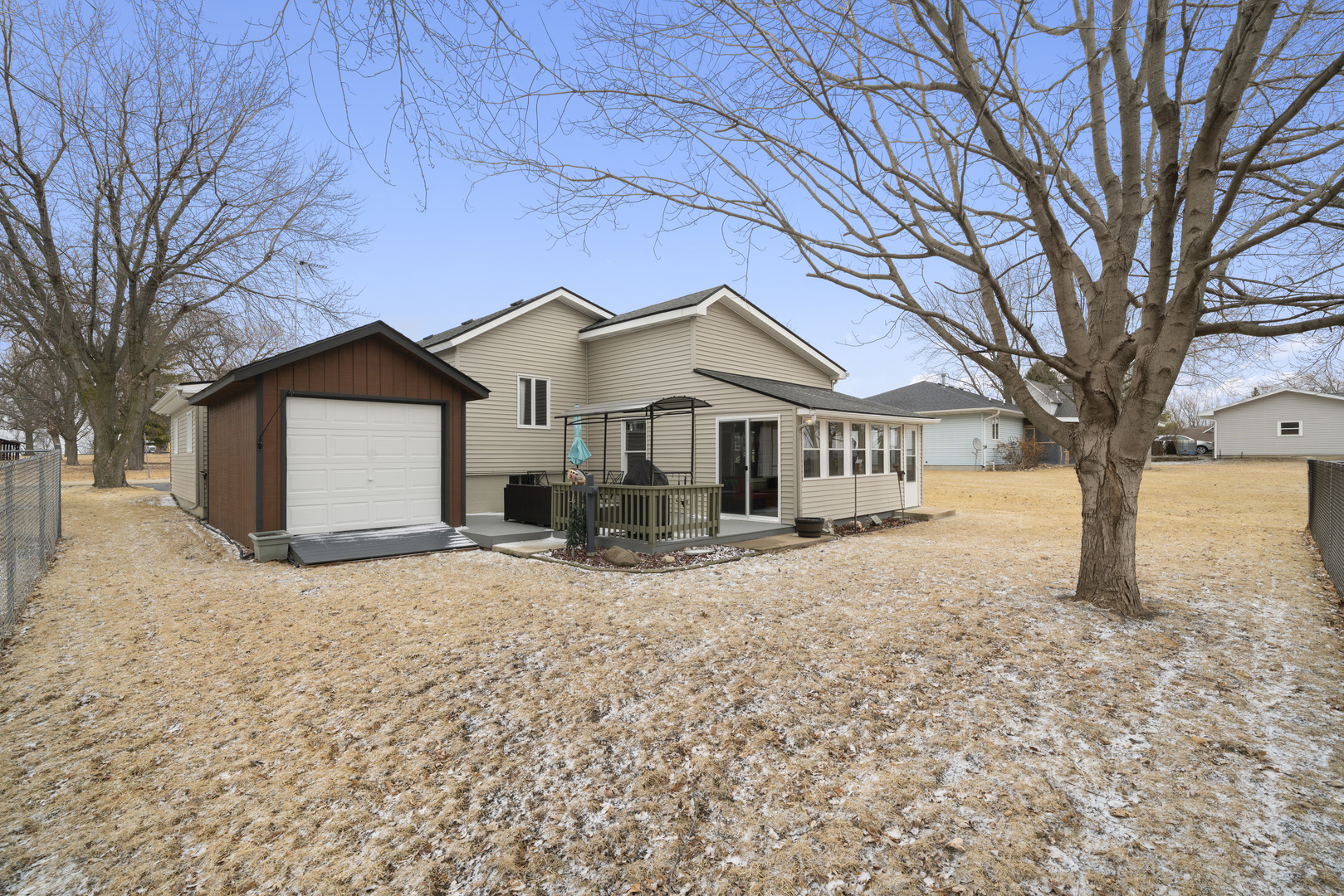 193 Chicago Road Paw Paw, IL 61353 - Photo 35 of 37 a front view of a house with a yard covered in snow