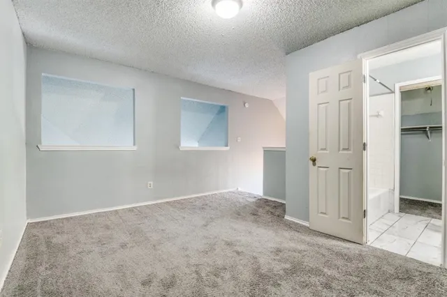 an empty room with closet area