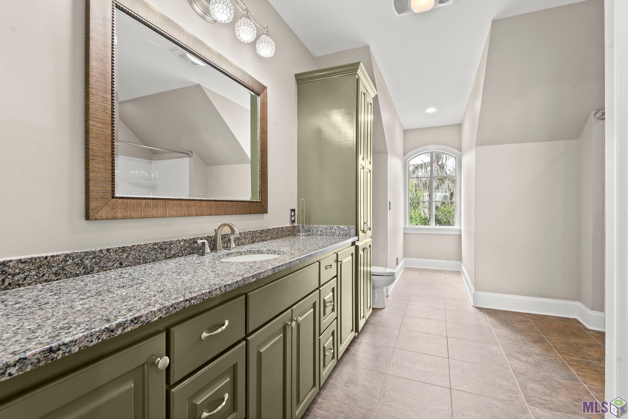 123 Lake Road Pierre Part, LA 70339 - Photo 28 of 59 Upstairs Guest Attached Bath
