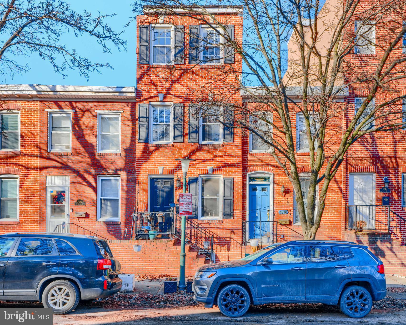 1520 Byrd Street Baltimore, MD 21230 - Photo 2 of 37 a front view of a house with parking space