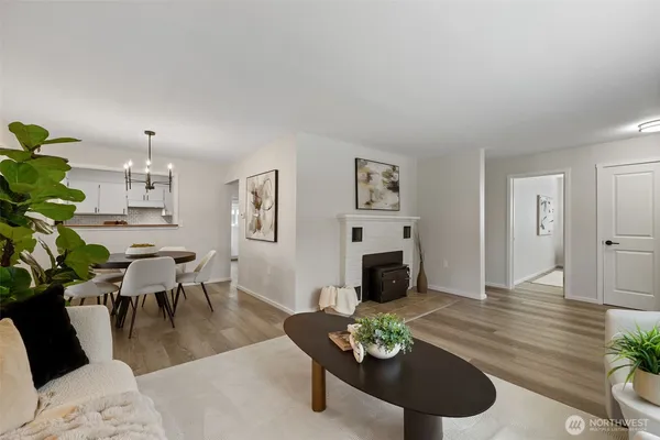 a living room with furniture couches and a fireplace