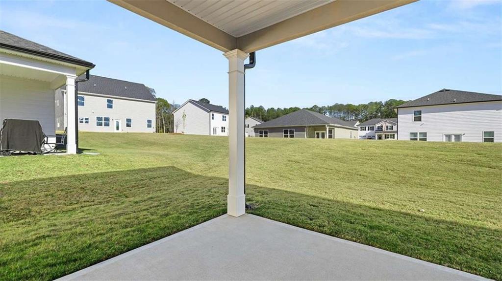 310 Friendship Oak Way Hampton, GA 30228 - Photo 15 of 41 a view of a big yard next to a yard with an ocean view