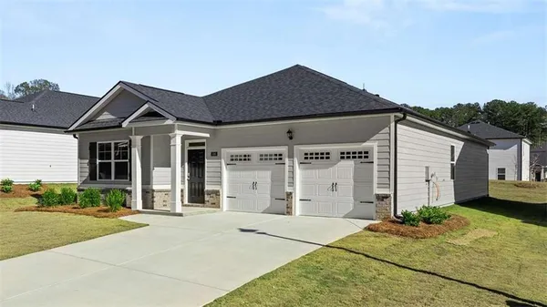 a front view of a house with a yard