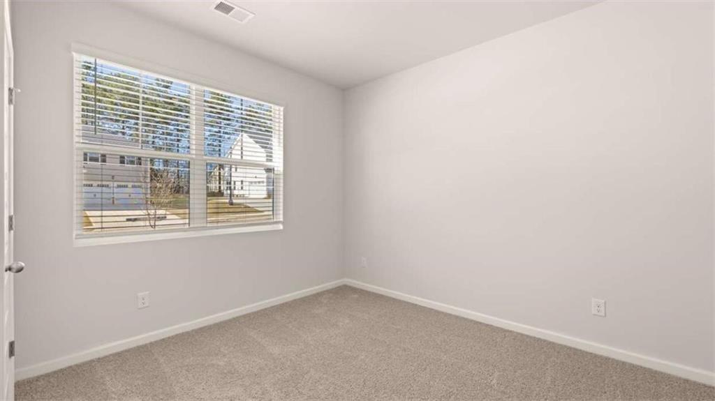310 Friendship Oak Way Hampton, GA 30228 - Photo 26 of 41 an empty room with a window
