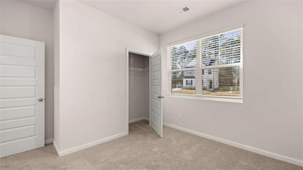 310 Friendship Oak Way Hampton, GA 30228 - Photo 27 of 41 a view of an empty room with a window