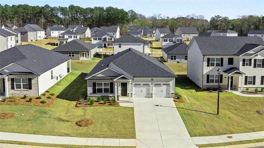 310 Friendship Oak Way Hampton, GA 30228 - Photo 3 of 41 a aerial view of a house with swimming pool