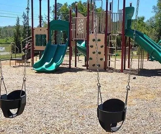 a view of swimming pool with a house in the background