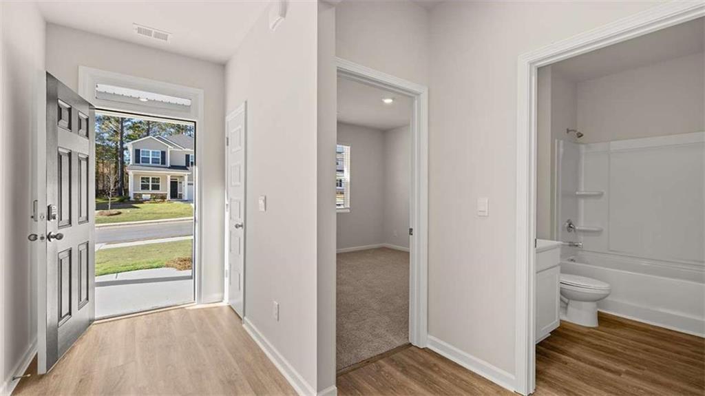 310 Friendship Oak Way Hampton, GA 30228 - Photo 5 of 41 a bathroom with a sink and a toilet