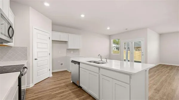 a kitchen with a sink and cabinets