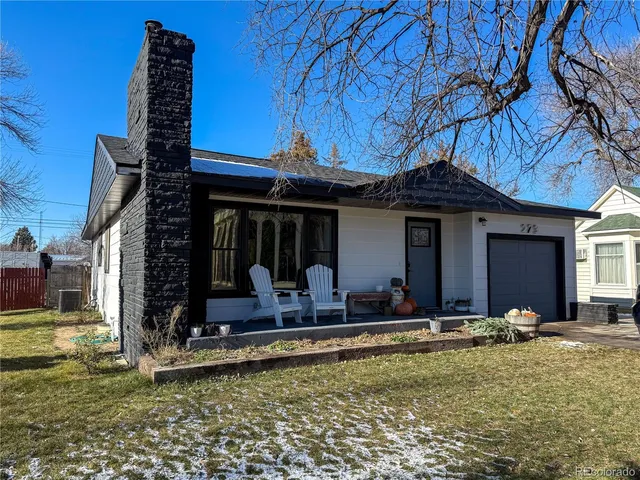 a view of room with workspace and windows