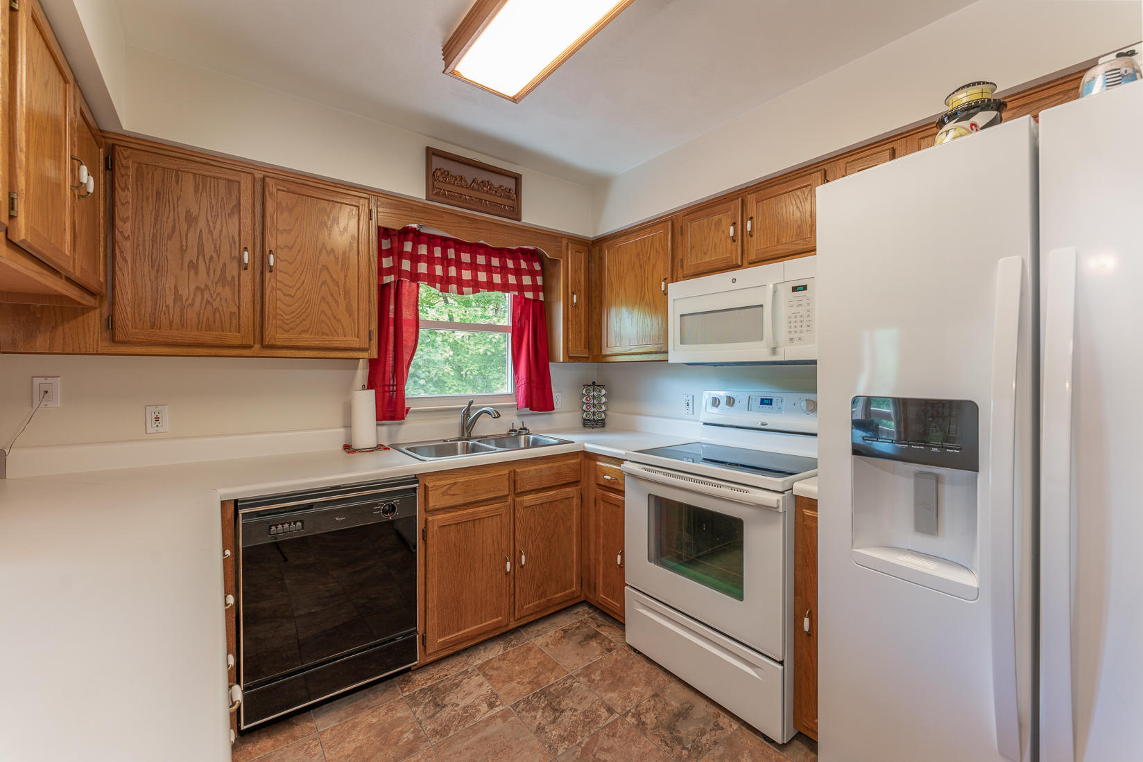 87 Oak Ridge Court Blue Ridge, VA 24064 - Photo 22 of 49 a kitchen with granite countertop a sink stainless steel appliances and cabinets
