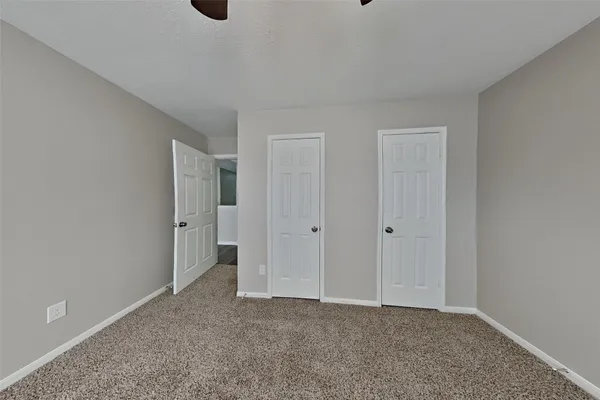 a view of an empty room and window