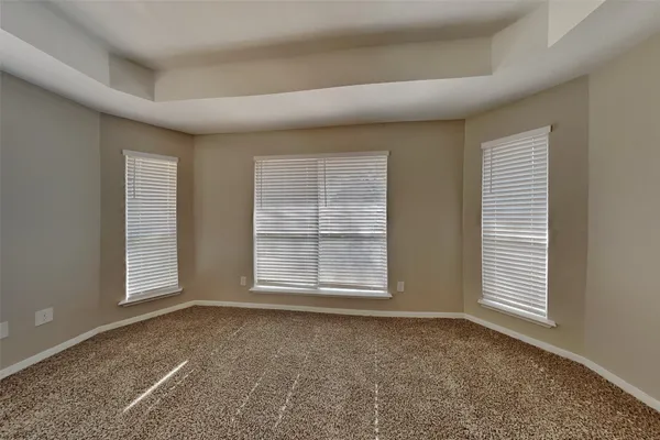a bathroom with a granite countertop sink vanity and mirror
