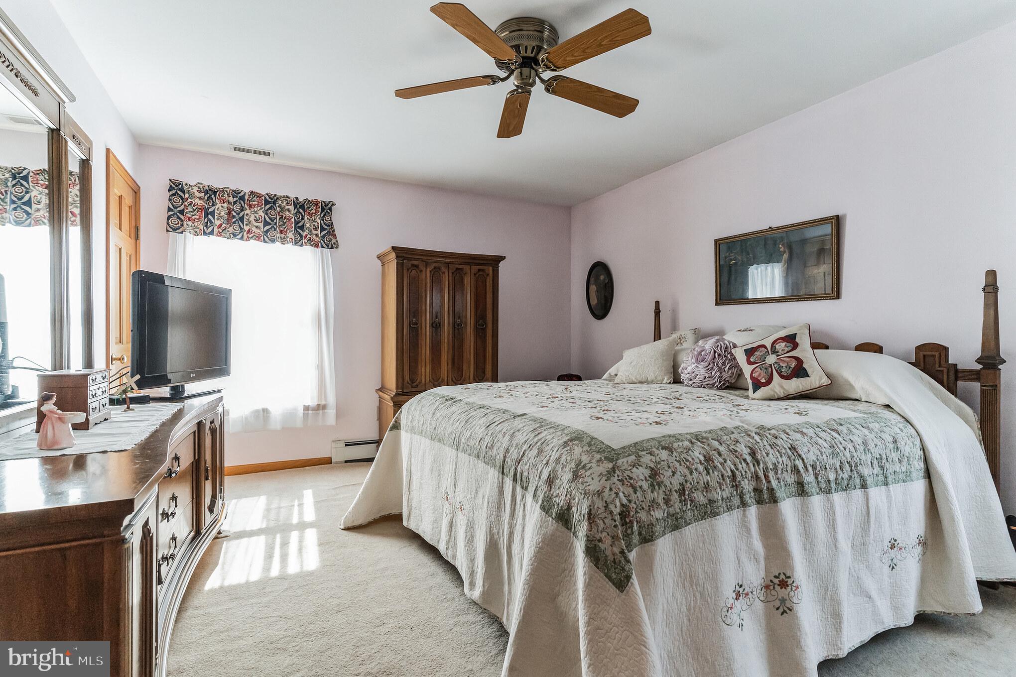 1776 Church Road Southampton, NJ 08088 - Photo 17 of 32 a bedroom with a bed and a flat screen tv