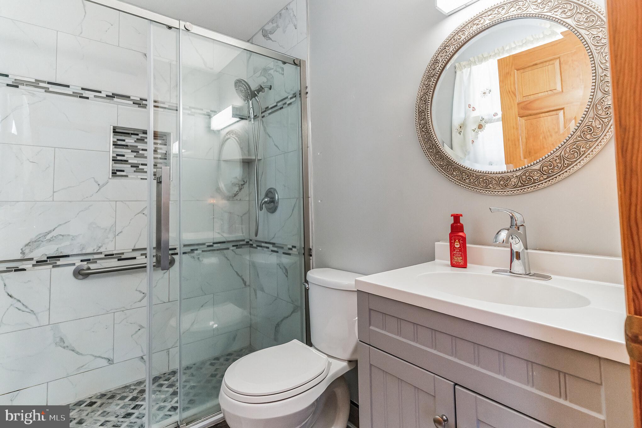 1776 Church Road Southampton, NJ 08088 - Photo 19 of 32 a bathroom with a sink a toilet and a shower