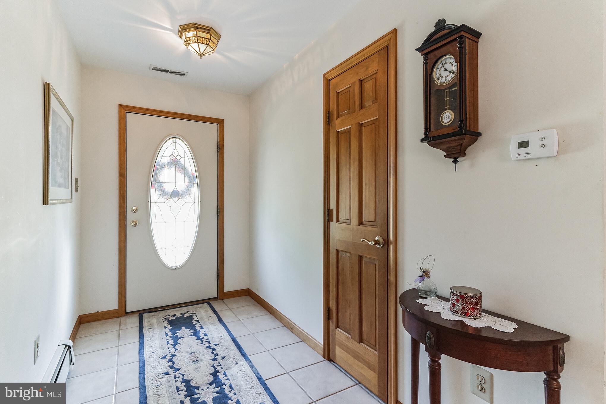 1776 Church Road Southampton, NJ 08088 - Photo 8 of 32 a view of a hallway with wooden floor and a mirror