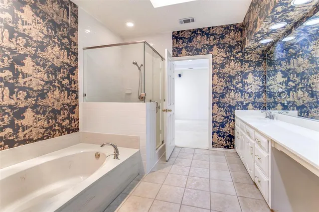 a bathroom with a bathtub and a sink