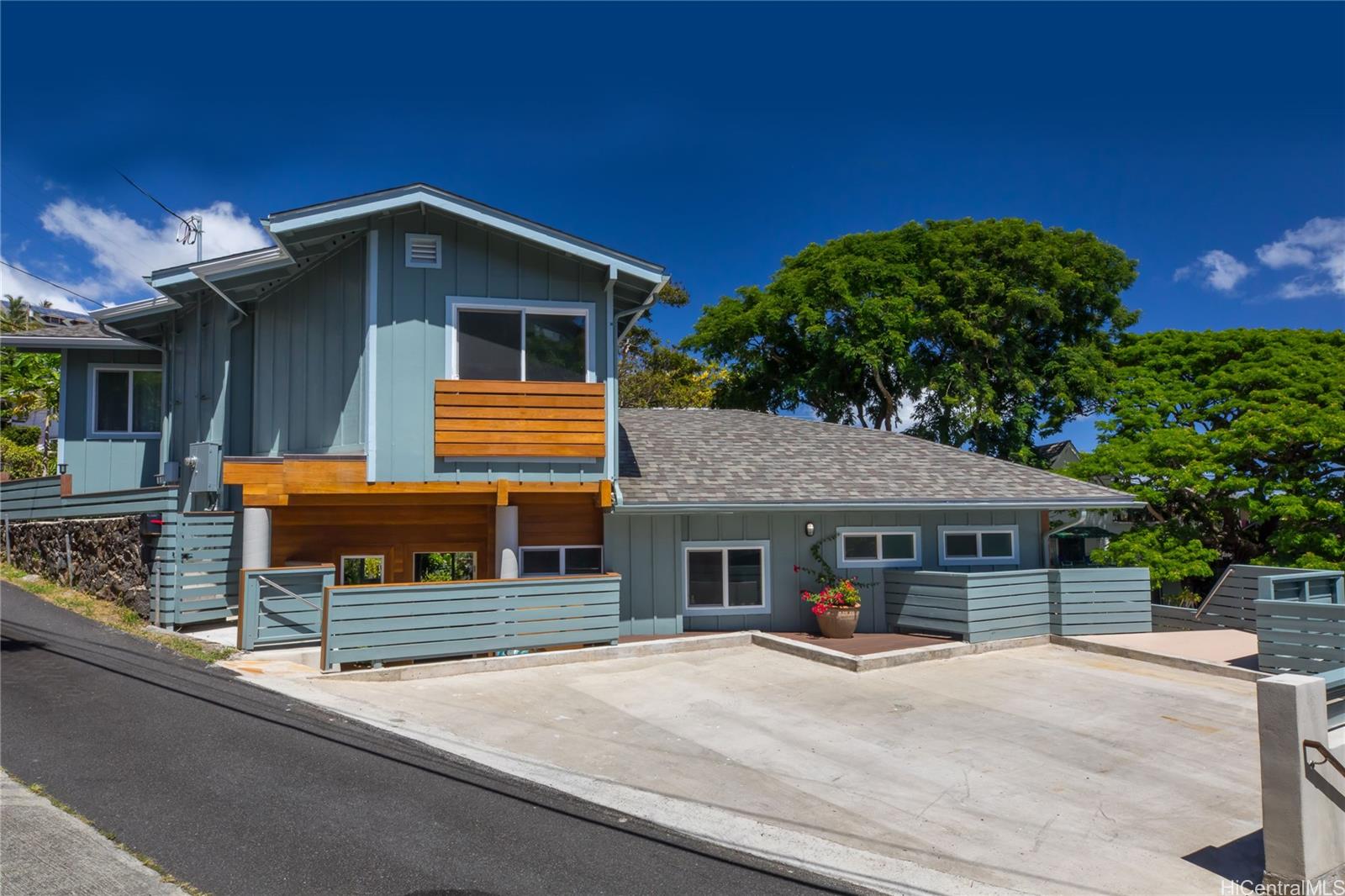 a front view of a house with table and chairs