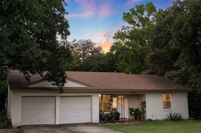 a aerial view of a house with a yard