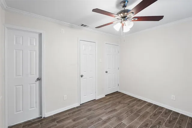 a white toilet sitting next to a white sink