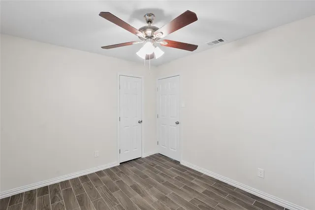 a white toilet sitting next to a bathroom sink