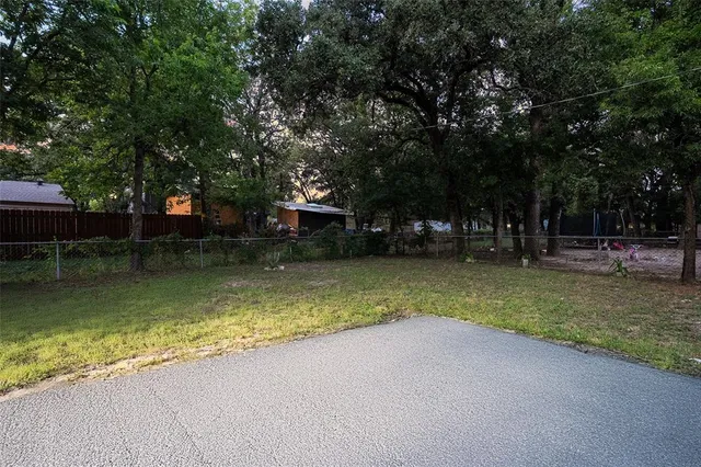 a view of a swimming pool with a garden