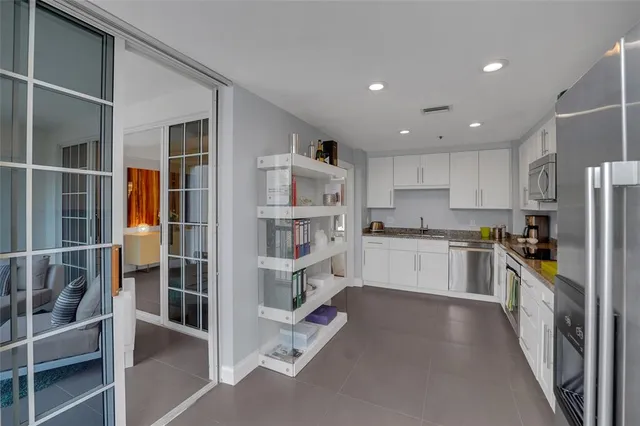 a bedroom with a bed couch and a window