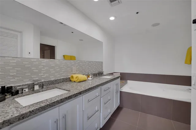 a view of a patio with furniture and a potted plant