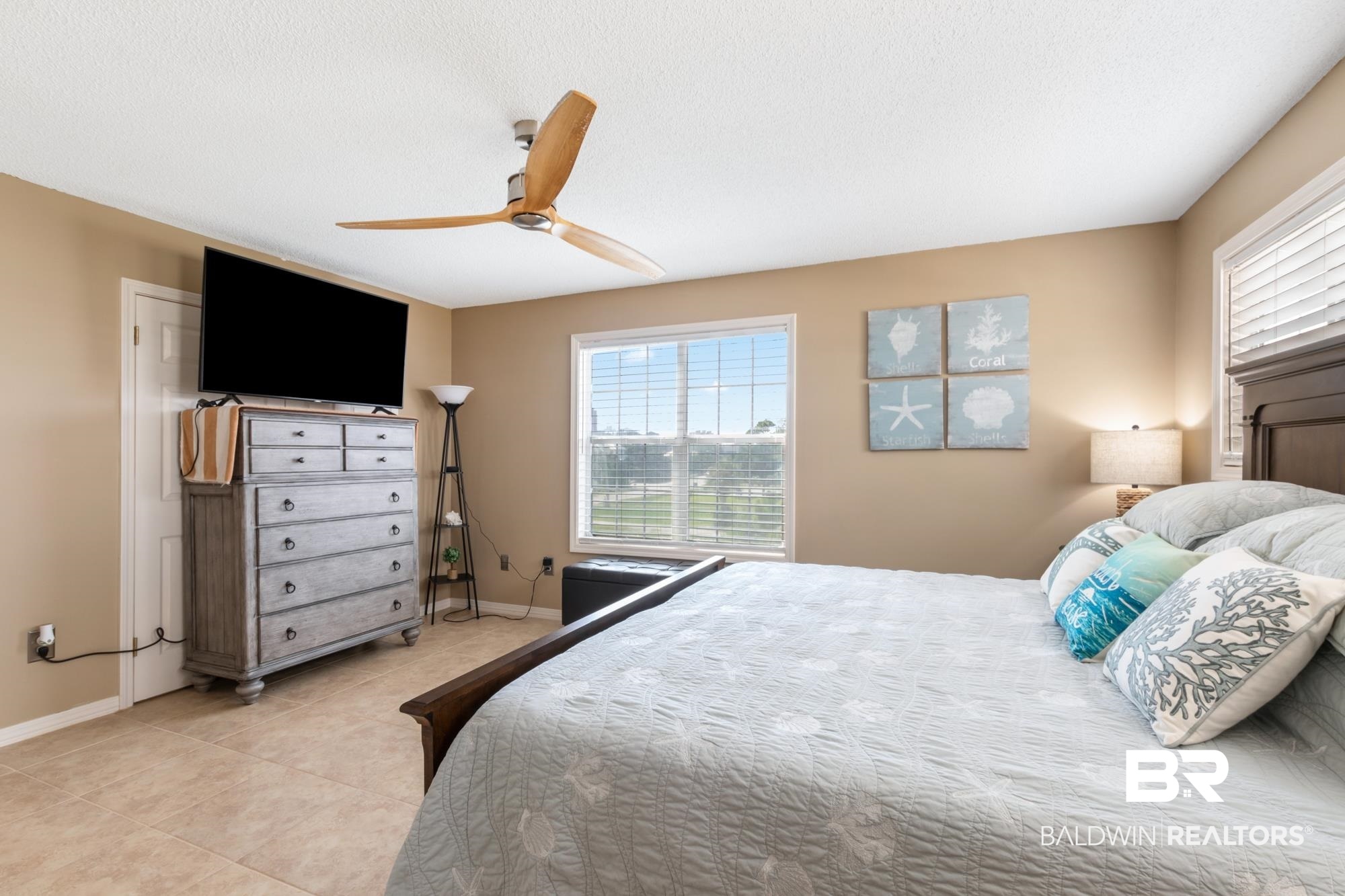 328 Windmill Ridge Road Gulf Shores, AL 36542 - Photo 20 of 47 Tiled bedroom featuring a textured ceiling and ceiling fan