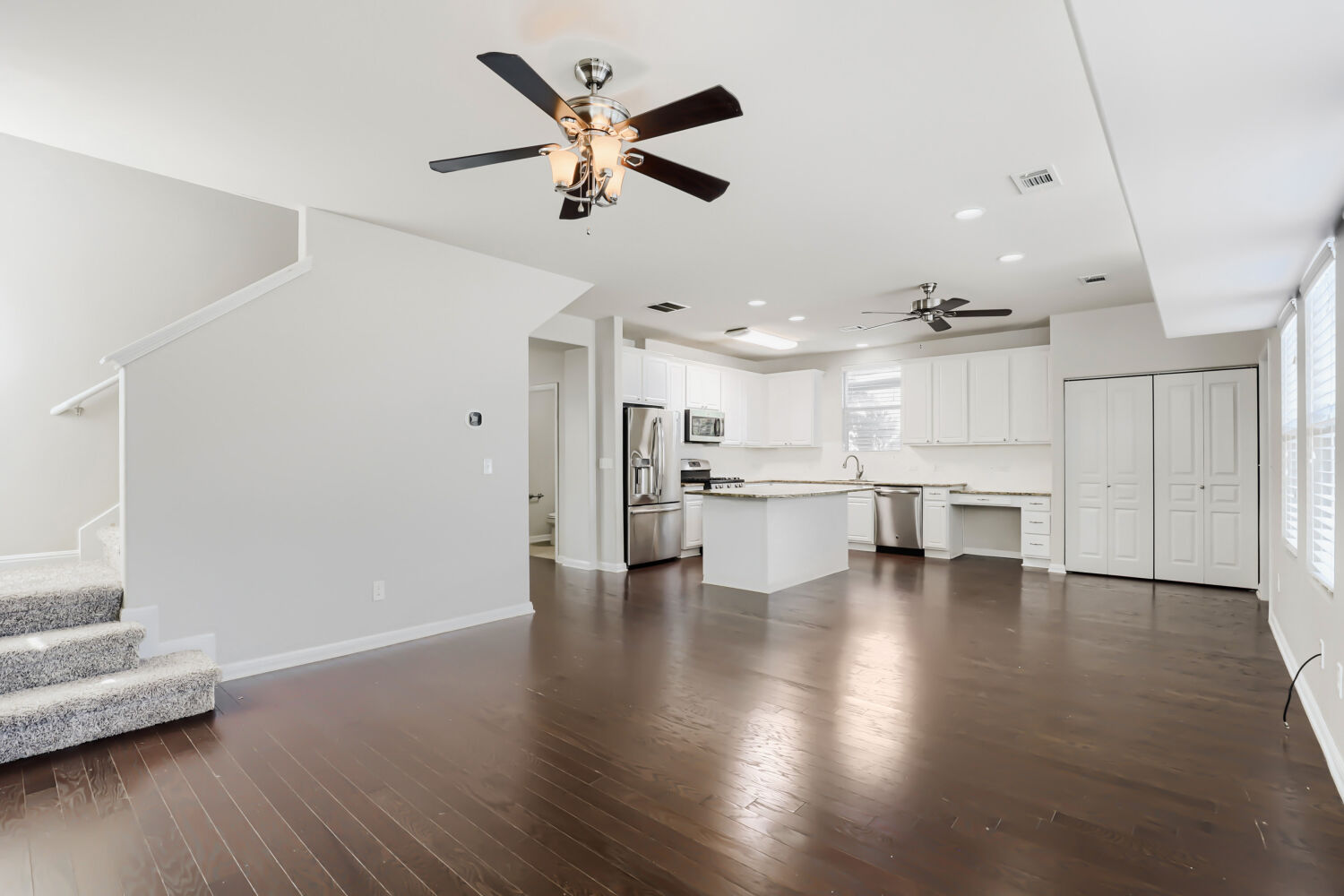 5136 Hellman Kyle, TX 78640 - Photo 13 of 25 a view of kitchen with wooden floor and windows