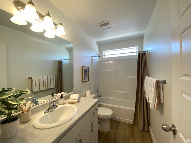 341 Quartz Road, Unit 8037 Tooele, UT 84074 - Photo 4 of 10 Full bathroom featuring a single vanity with an integrated sink, a large mirror, and a combination tub and shower