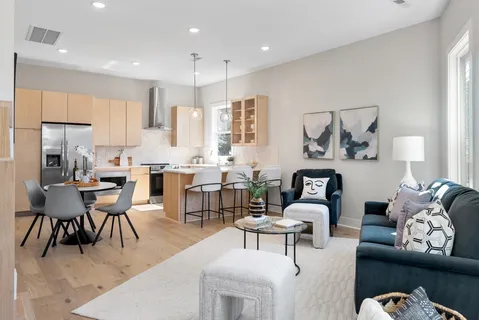 a kitchen with a sink cabinets and wooden floor
