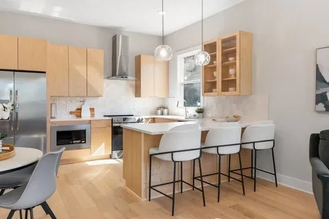 a kitchen with a sink stove and cabinets