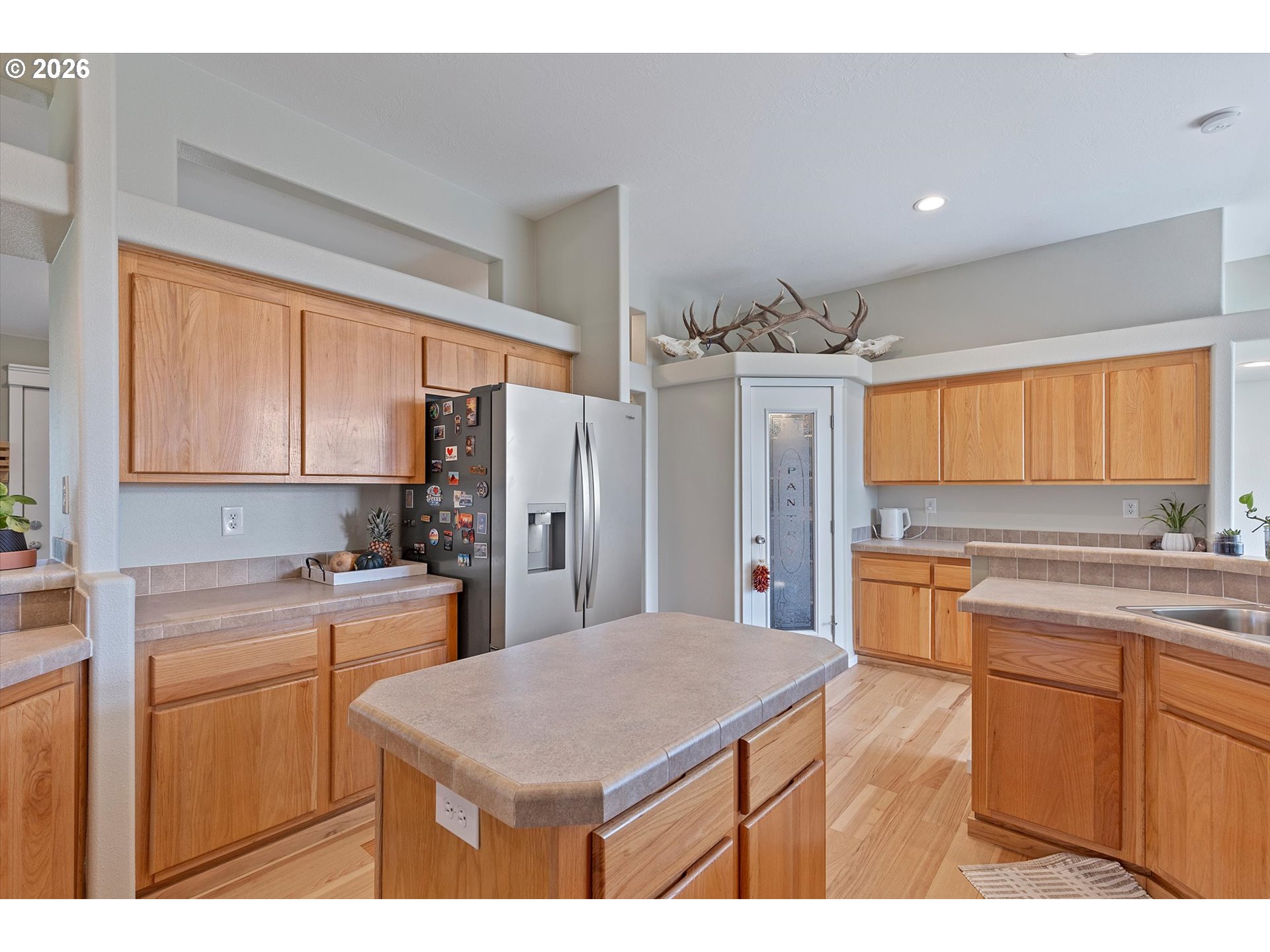 1206 Criteser Loop Toledo, OR 97391 - Photo 10 of 46 a kitchen with refrigerator and cabinets