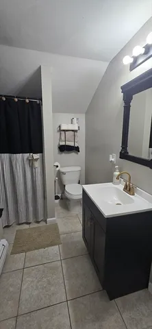 a kitchen with a sink and a refrigerator