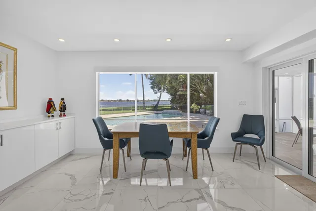 a kitchen with stainless steel appliances kitchen island sink stove and refrigerator