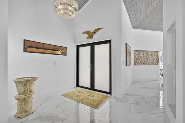 a living room with furniture and air hockey table