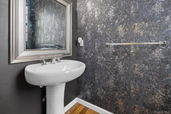 a bathroom with a sink and mirror