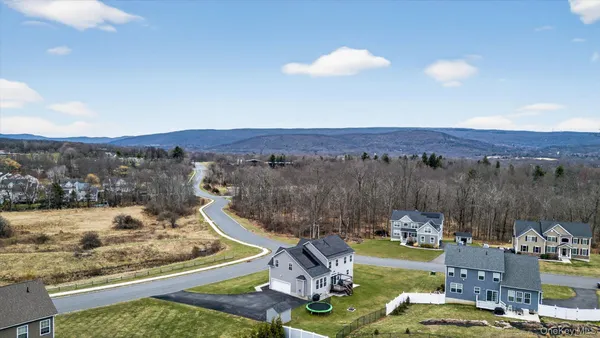 a view of a swimming pool with a yard