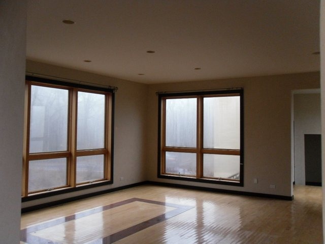 132 Old Dundee Road Barrington, IL 60010 - Photo 12 of 22 a view of a room with wooden floor and windows