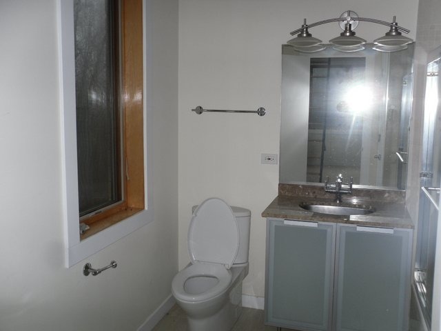 132 Old Dundee Road Barrington, IL 60010 - Photo 21 of 22 a bathroom with a toilet sink and mirror