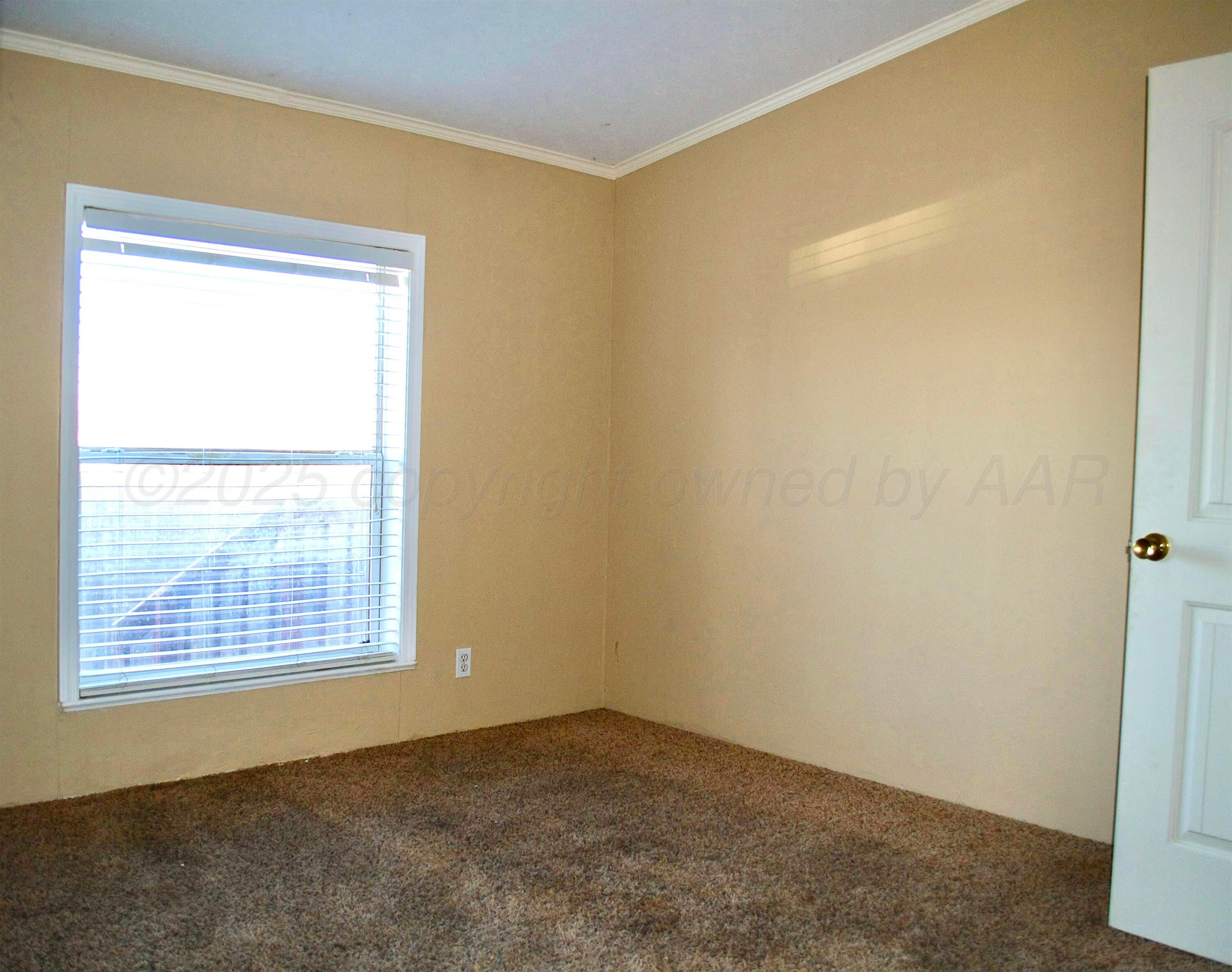 406 North Independence Street Amarillo, TX 79106 - Photo 11 of 19 a view of an empty room with a window