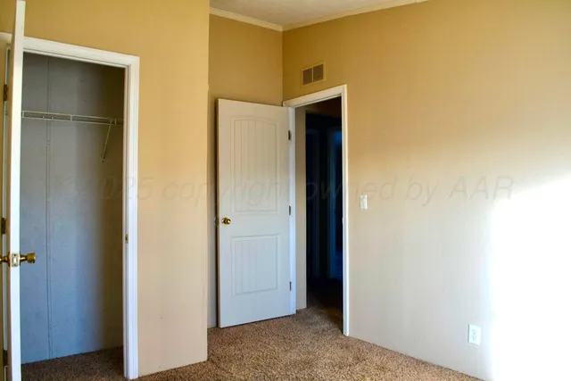 a view of a hallway with closet